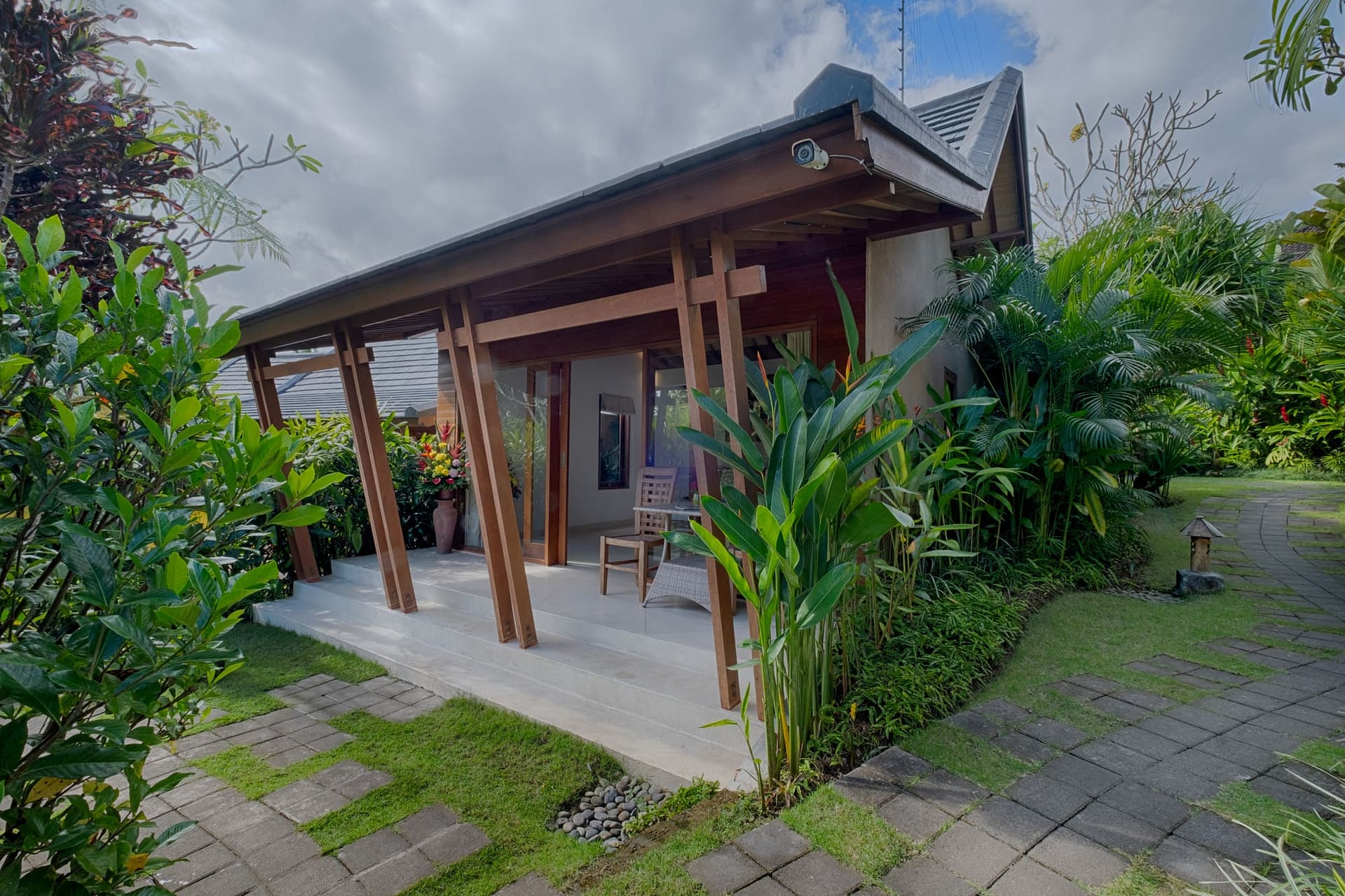 Luxury private pool villa building with tropical garden view at Tegaltis Villas Ubud