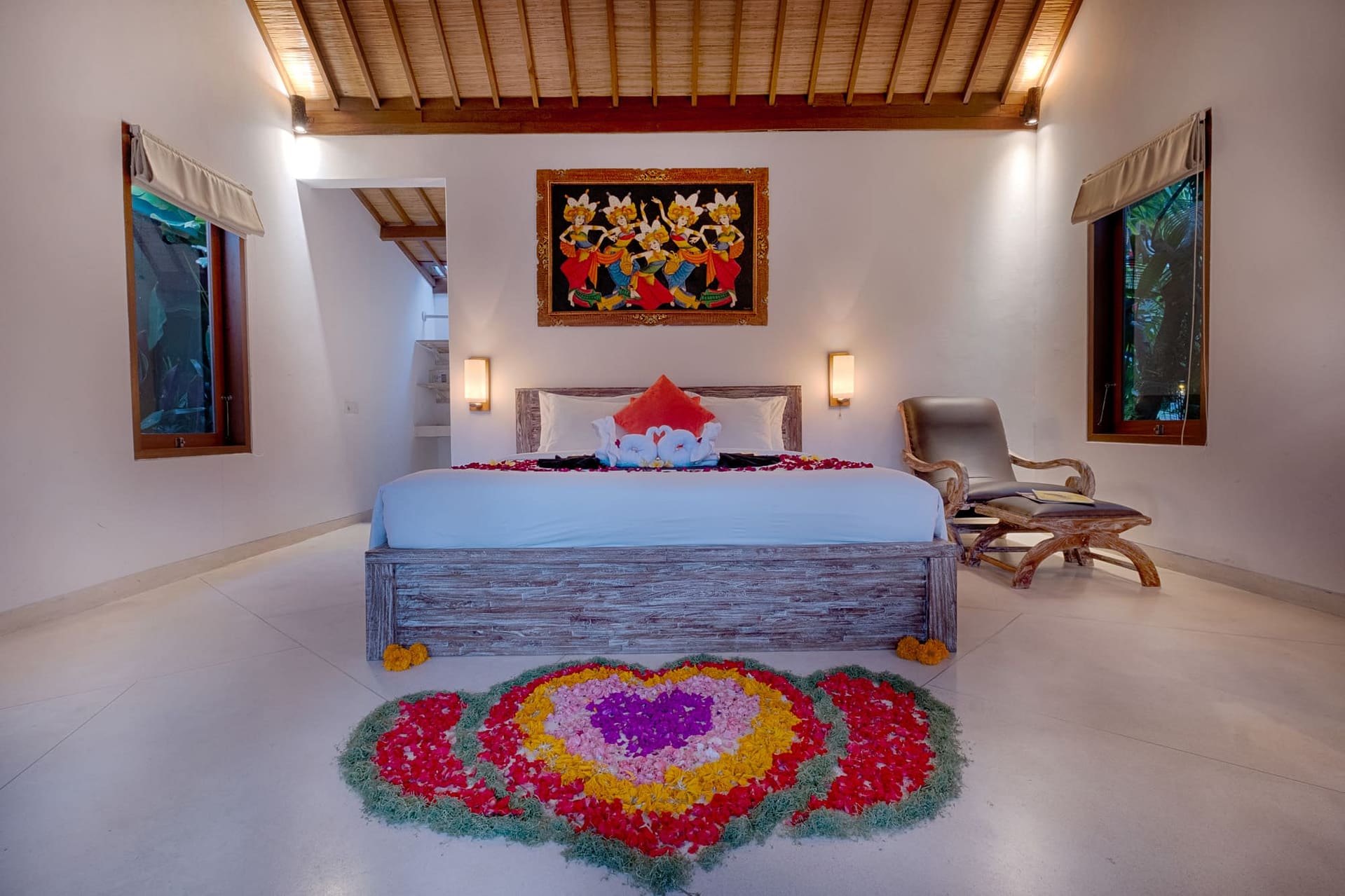 Romantic honeymoon room decoration with flower bed arrangement at Tegaltis Villas Ubud Bali